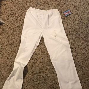 White scrub pants. Never worn. New with tags. Xs